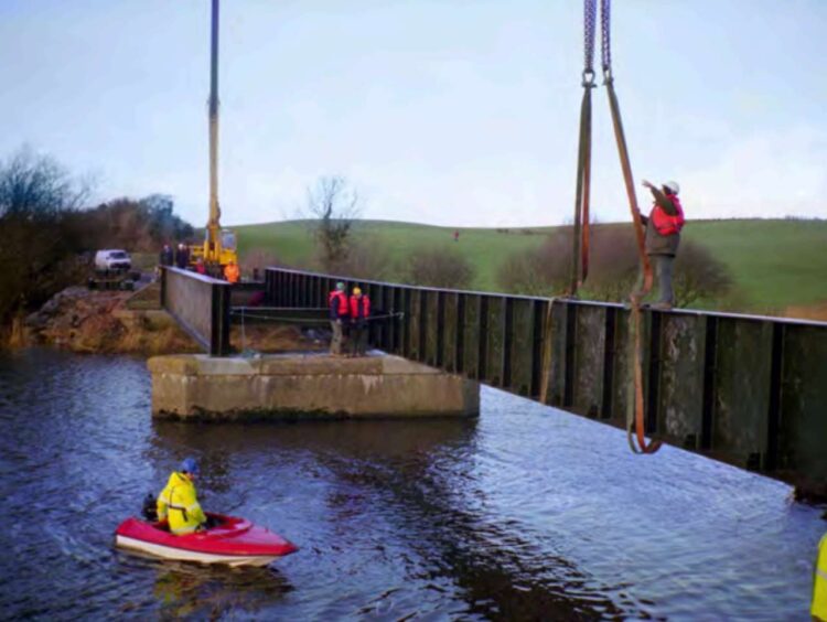 The bridge starts to take shape. 