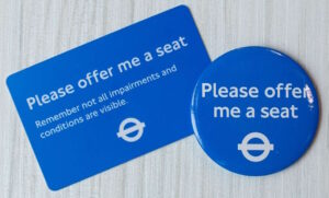 Please Offer Me a Seat badge and card