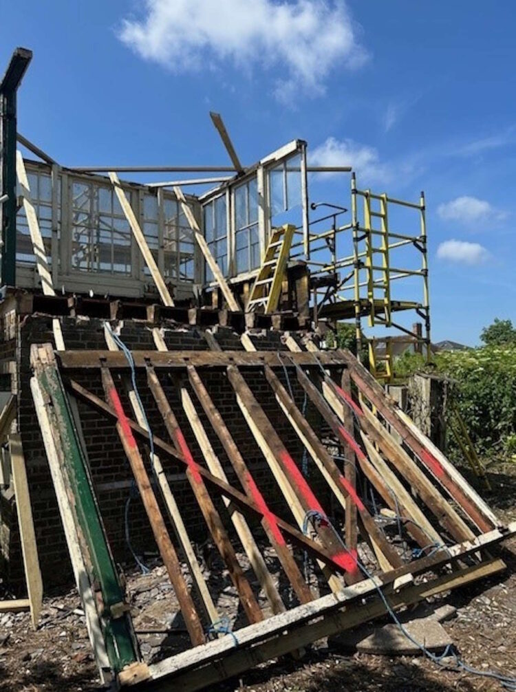 stripping out the floor of Wye signal box. // Credit: Network Rail