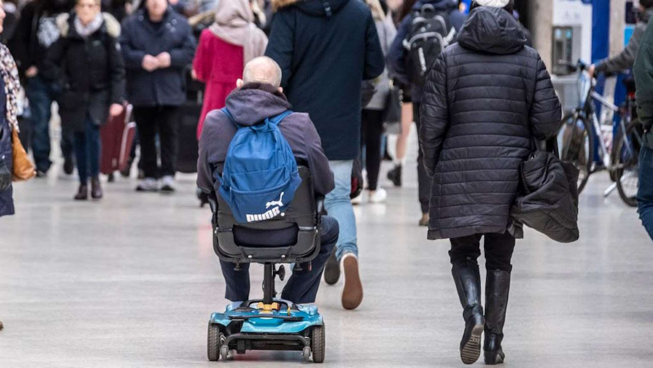 Passenger with mobility scooter