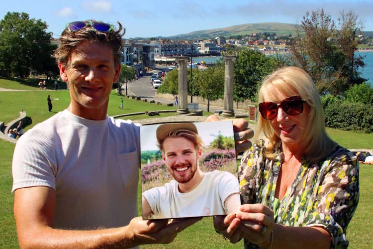 Jonathan and Vicki Searle with a photo of their son, Henry. // Credit: Andrew PM Wright