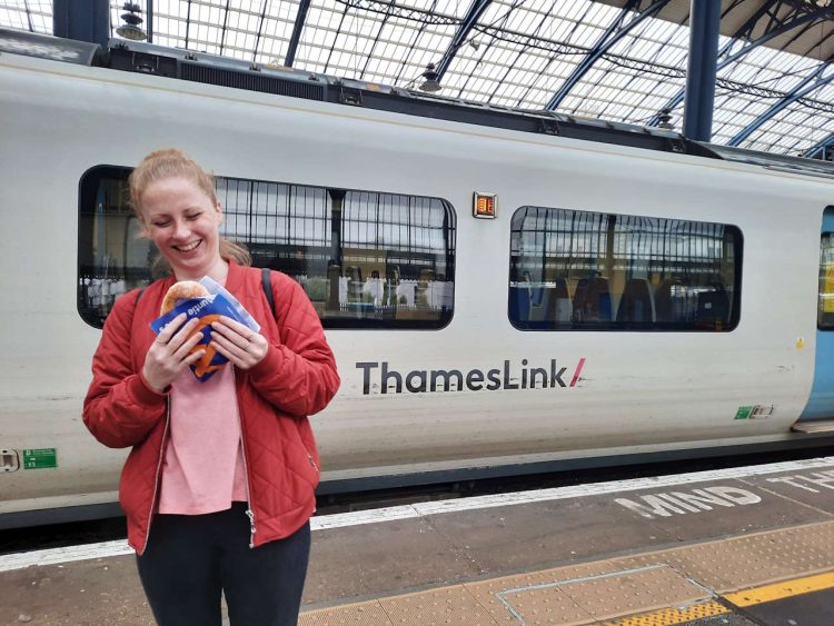 A customer enjoying pretzels at Aunt Annie's new store in Brighton. // Credit: Govia Thameslink Railway