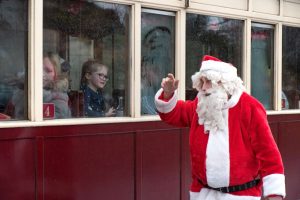 Santa waving at passengers on a Welsh Highland Railway train