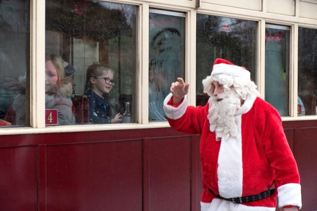 Santa waving at passengers on a Welsh Highland Railway train