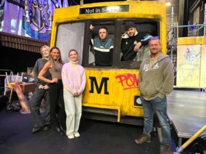 the replica Metro train on the stage at the Theatre Royal ahead of the Gerry and Sewell production with cast members standing next to it