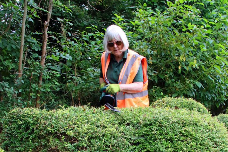 Volunteer Judy Tovey at Harman's Cross station. // Credit: Andrew P.M. Wright