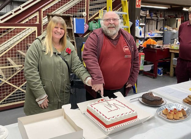 Debbie Cross and retiring Chairman Trevor England cutting a cake at the VCT Museum, Ingrow. // Credit: Vintage Carriages Trust