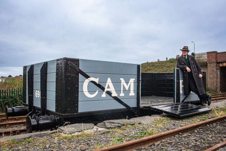 The wagon with the side door open at Tywyn Wharf. // Credit: Talyllyn Railway