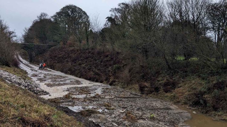 Network Rail is working to resolve the flooding and collapsed cutting in Ulverston - Network Rail