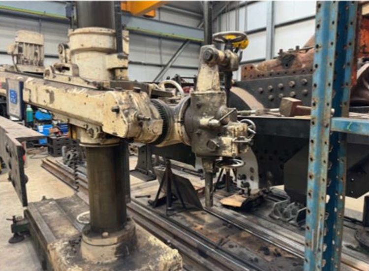 A radial drill working on the chassis. // Credit: Leaky Finders 