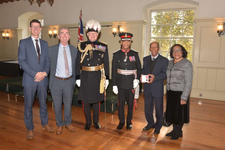 Siggy Cragwell (pictured second right with his niece, Myrtle) receives his BEM at the Tower of London