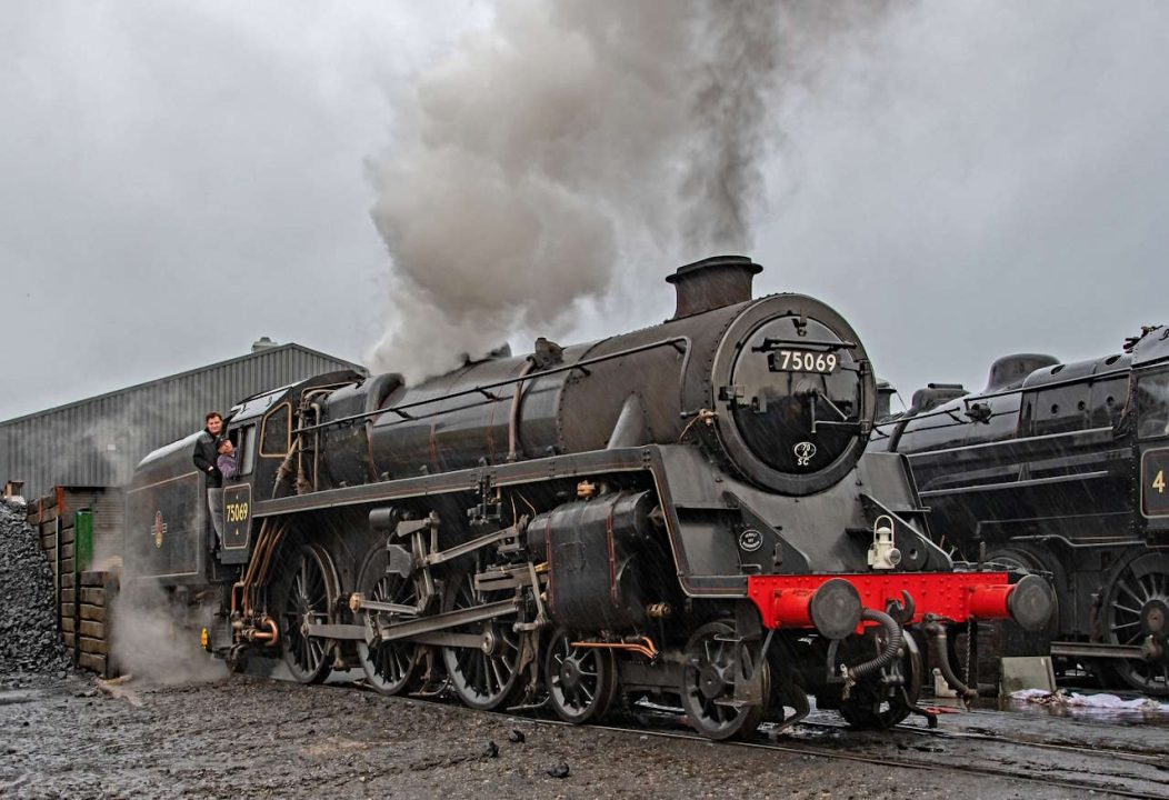 Driver Mick Matthews whistles up with fireman Alex Robinson prepare for Santa services // Credit John Titlow