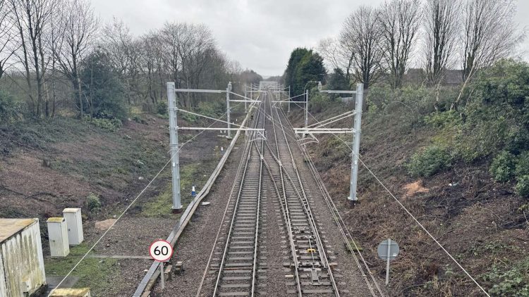 Newly installed power lines between Wigan to Bolton. // Credit: Network Rail